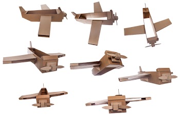 collection of cardboard airplane toy isolated on white background