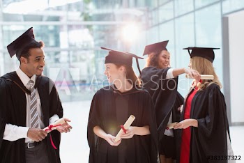College students in caps and gowns graduating