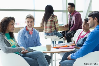 College students talking and studying in student lounge