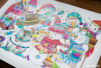 Colored snowmans in a drwing book by a child