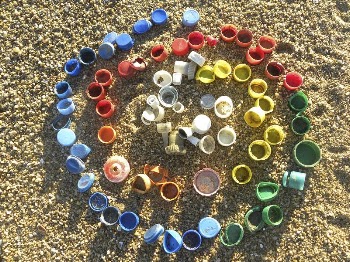 Colorful caps on sand. Original | Free Photo - rawpixel