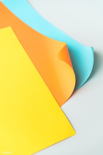 Colorful curled paper on a gray background | Free  photo - 2353879