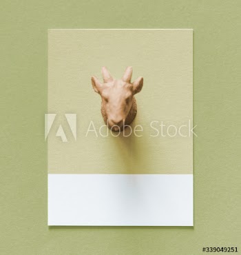 Colorful goat figure on a paper