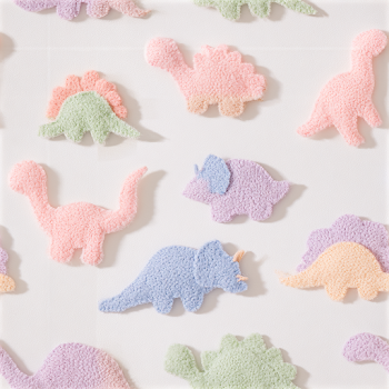 Colorful Handmade Felt Dinosaurs on White Background