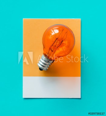 Colorful light bulb on a paper