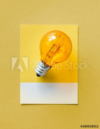 Colorful light bulb on a paper