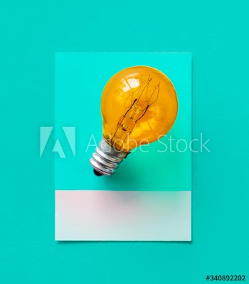 Colorful light bulb on a paper