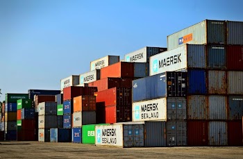 Colorful Shipping Containers Stacked at a Port