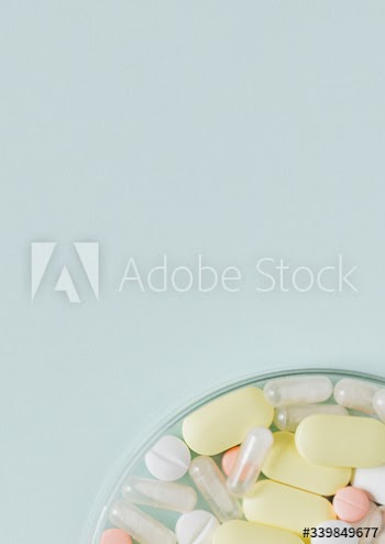 Colorful tablets in a bowl flatlay