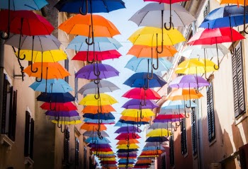 Colorful umbrellas hanging above the street