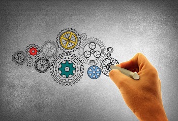  Concept of Work - A Person Drawing Cogwheels 