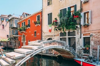 concrete bridge beside white building