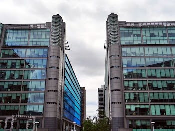 Concrete Building Under Cloudy Sky