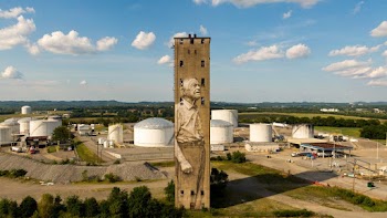 Concrete Building With Mural On An Industrial Plant