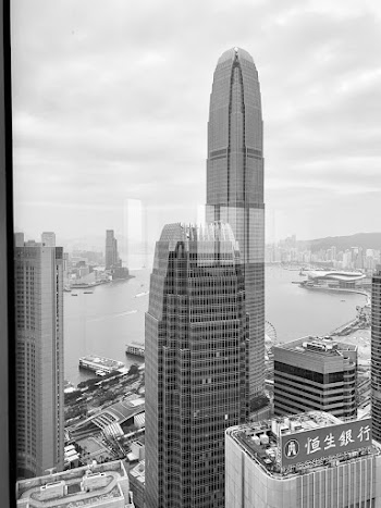 Concrete Buildings In Greyscale Photography