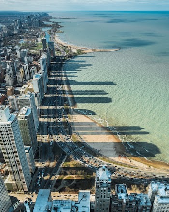 Concrete Buildings Near Blue Water