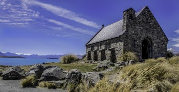 Concrete House Beside Body of Water