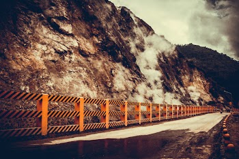 Concrete Road Near Mountain at Daytime