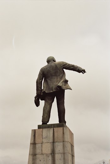 Concrete Statue Under Cloudy Sky