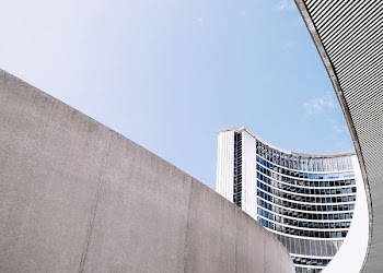 Concrete walls near the curved building of Toronto City Hall