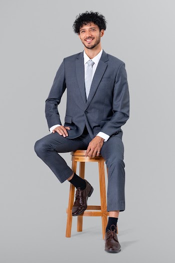 Confident businessman sitting on a wooden… | Free stock photo | High Resolution image