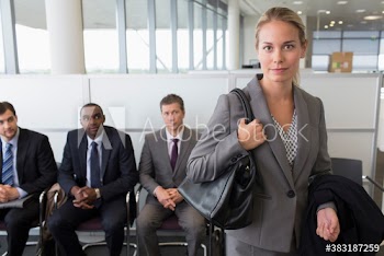 Confident businesswoman in office lobby