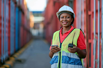 Confident Female Logistics Worker in Shipping Yard