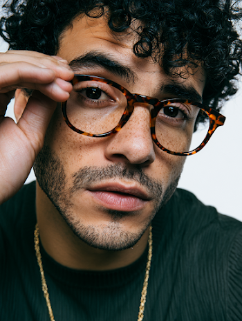 Confident Man Adjusting Glasses