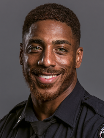 Confident Young Black Police Officer with Hazel Green Eyes