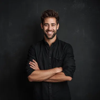 Confident Young Man Smiling with Arms Crossed Confident Young Man Smiling with Arms Crossed