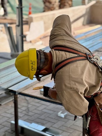 Construction Worker Focusing on Steel Framework