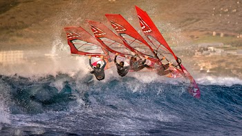 Continuous Shot of a Windsurfer Riding a Wave