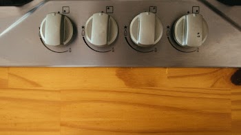Control Knobs Near Wooden Plank