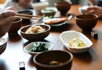 cooked food on plates and bowls
