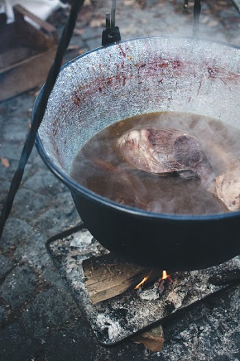 Cooking in a kettle outside 