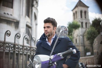 Cool handsome man on scooter, Paris, France