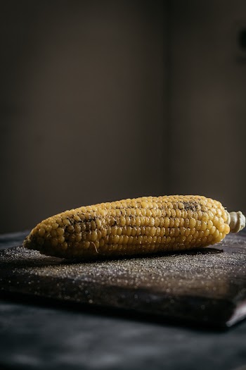 Corn on Brown Chopping Board
