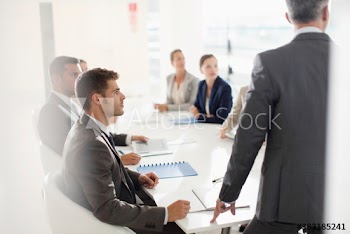 Corporate business people listening in conference room meeting