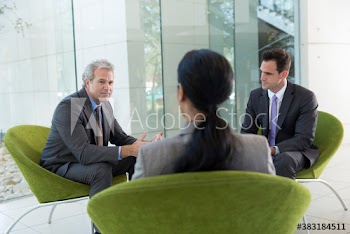 Corporate business people meeting in office lobby