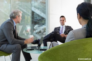 Corporate business people meeting in office lobby