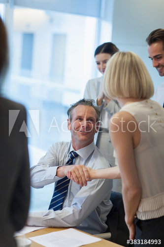 Corporate business people shaking hands in conference room meeting