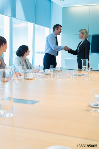 Corporate business people shaking hands in conference room meeting