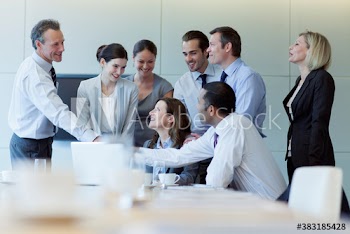 Corporate business people shaking hands in conference room meeting