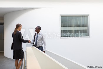 Corporate business people shaking hands in office