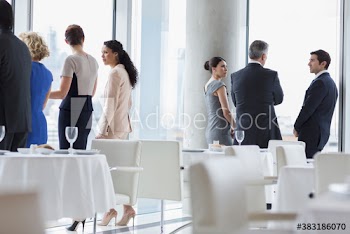Corporate business people talking at conference