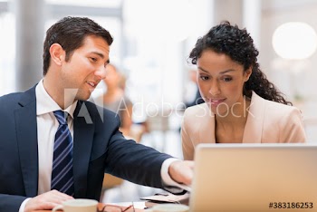 Corporate business people talking at laptop