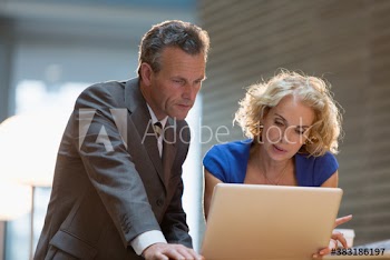 Corporate business people using laptop