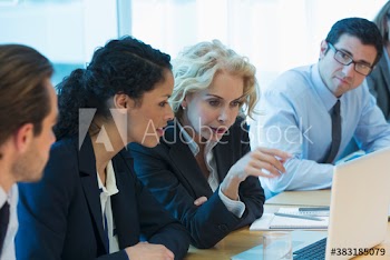 Corporate business people using laptop in conference room meeting