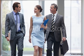 Corporate business people walking in office