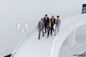 Corporate business people walking on modern ramp